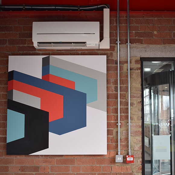 air conditioning installation with artwork on wall
