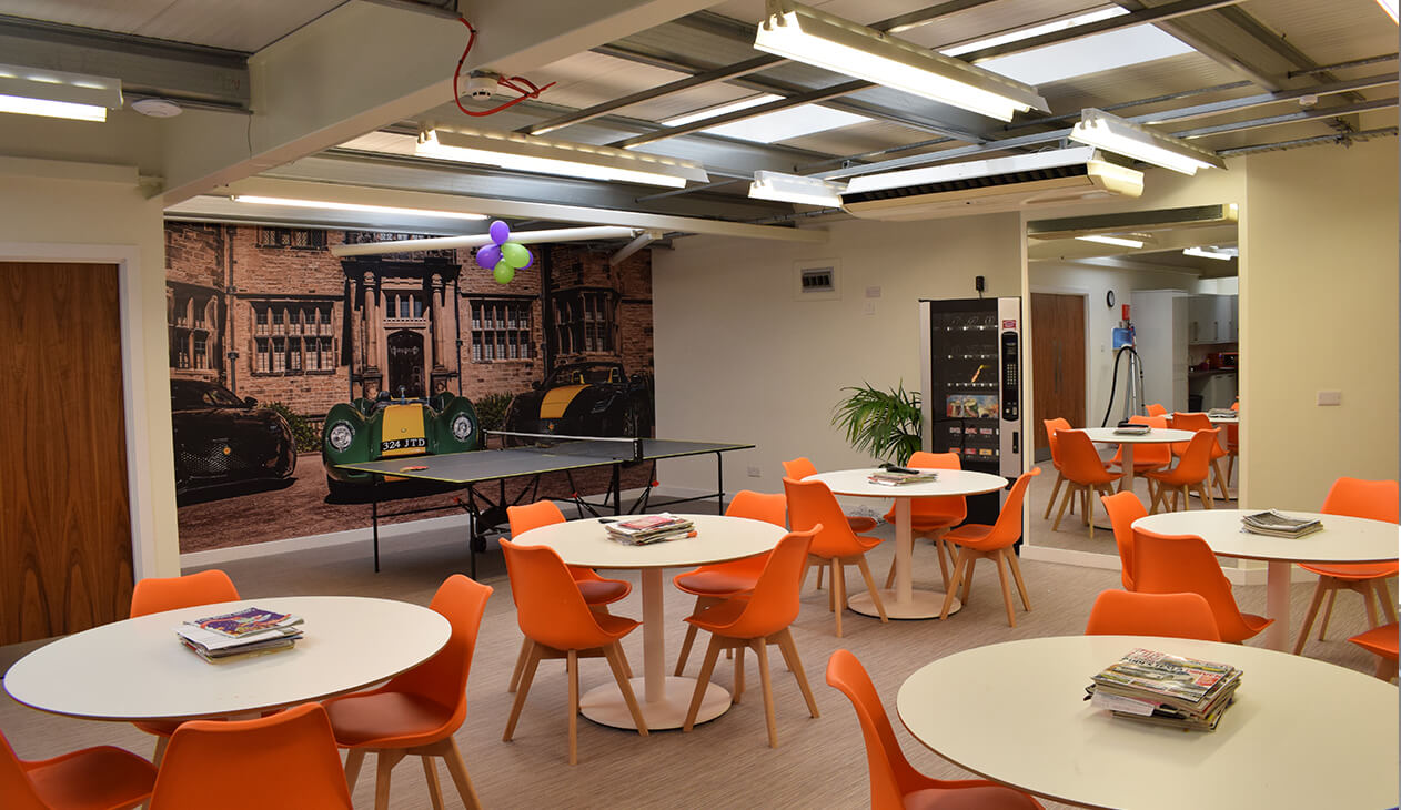 orange chairs and white tables